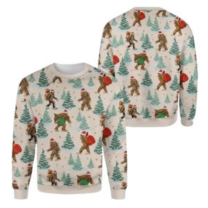 May include: A beige crewneck sweatshirt featuring an all-over print of brown Bigfoot figures wearing red Santa hats. The figures are carrying red or green gift sacks through a pattern of green pine trees and small yellow stars.