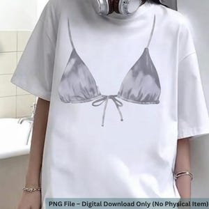 Puede incluir: Camiseta blanca con un diseño de top de bikini gris. El diseño del top de bikini incluye un lazo y un efecto acuarela. El texto en la parte inferior de la imagen dice "PNG File - Digital Download Only (No Physical Item)".