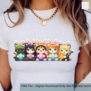 May include: White t-shirt featuring a colorful graphic of five cartoon cats dressed as Easter bunnies, each holding a decorated egg. The cats have different colored fur and outfits. The text at the bottom reads "PNG File - Digital Download Only (No Physical Item)".