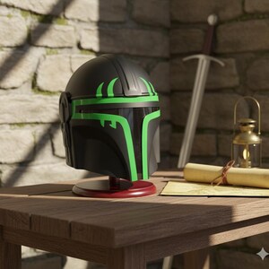 May include: A black helmet with green accents, displayed on a red stand. The helmet has a visor and is set on a wooden table with a sword, lantern, and scroll in the background. The helmet is a cosplay item.