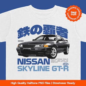 May include: White t-shirt featuring a black Nissan Skyline GT-R car graphic. The design includes Japanese characters, the year 1989, and the text "NISSAN SKYLINE GT-R". The shirt has a classic crew neck.