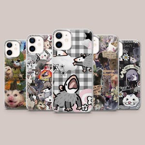 May include: A collection of five phone cases featuring possum illustrations. The cases display various designs, including possums with text, a black and white checkered pattern, and collage-style arrangements. The cases are designed for a smartphone.