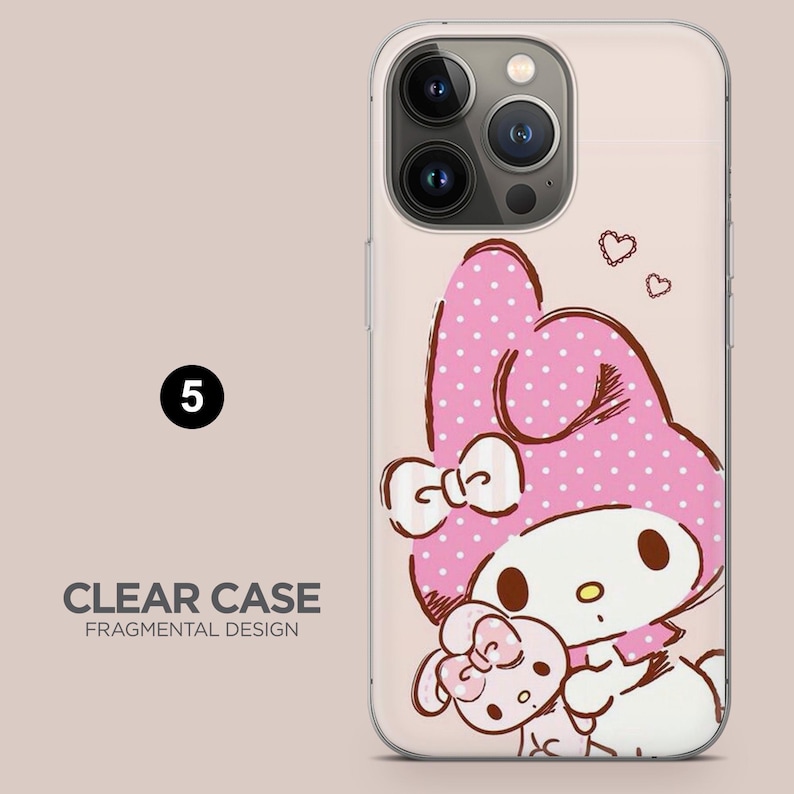 May include: Clear phone case featuring a cartoon character with a pink polka-dot hat and bow. The case has a clear background with the text "CLEAR CASE FRAGMENTAL DESIGN" and the number "5".