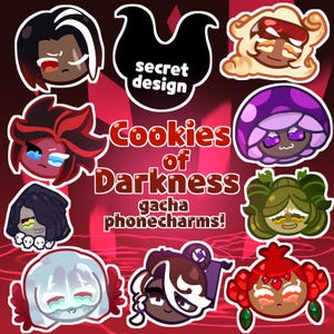May include: A promotional image for "Cookies of Darkness" gacha phone charms. The image features several cartoon character designs with various expressions and colors, including red, purple, and green. Text includes "secret design" and "Cookies of Darkness gacha phone charms!"