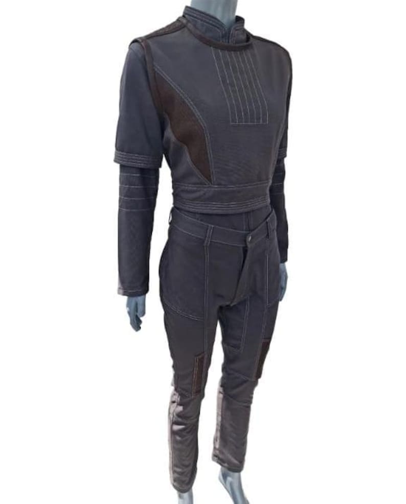 May include: A set of three ceramic mugs with a speckled, matte finish. Each mug features a different color: light blue, cream, and gray. The mugs have a simple, modern design with a rounded shape and a comfortable handle.