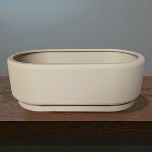 Puede incluir: Un juego de tres tazas de cer&aacute;mica con acabado moteado y mate. Las tazas son de color crema, gris claro y gris oscuro. Cada taza tiene un dise&ntilde;o simple y minimalista.