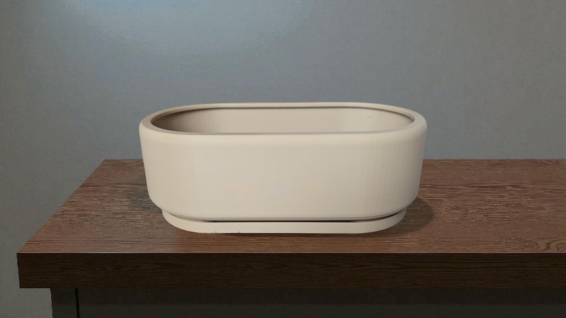 Puede incluir: Un juego de tres tazas de cer&aacute;mica con acabado moteado y mate. Las tazas son de color crema, gris claro y gris oscuro. Cada taza tiene un dise&ntilde;o simple y minimalista.