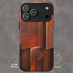 May include: A brown and orange iPhone case with a wood-like design. The case features a textured pattern with the words "Oxide Blocks" and "iPhone" printed on it. The case has a black camera module with three lenses.
