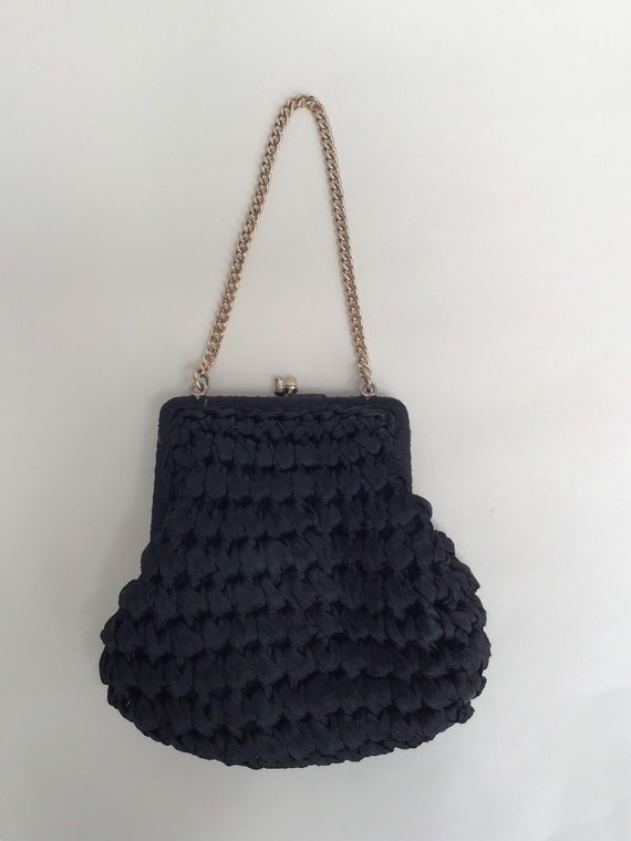 small black bag with gold chain
