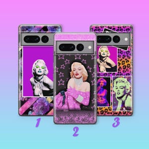 May include: Three phone cases featuring images of Marilyn Monroe. The cases have different designs, including floral, star, and leopard print patterns. The images of Marilyn Monroe are in various poses and styles, with vibrant colors.