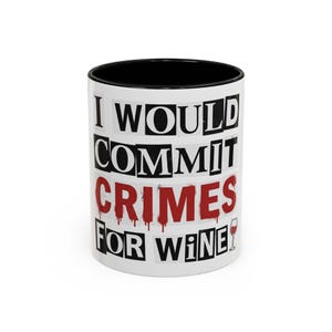 May include: White ceramic mug with a black interior. The mug features the text "I WOULD COMMIT CRIMES FOR WINE" in a ransom note style, with red dripping letters for "CRIMES". A small wine glass graphic is also present.