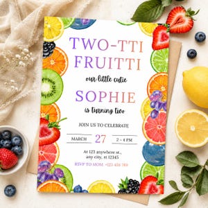 May include: A vibrant birthday invitation featuring the text "TWO-TTI FRUITTI" and "SOPHIE is turning two." The design incorporates watercolor fruit illustrations, including oranges, strawberries, and kiwis. The invitation is for a birthday celebration.