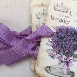 May include: Set of vintage-style gift tags with a lavender theme. Each tag features a crown, the text "No. 1 Lavender", and a bouquet of lavender in a hat.