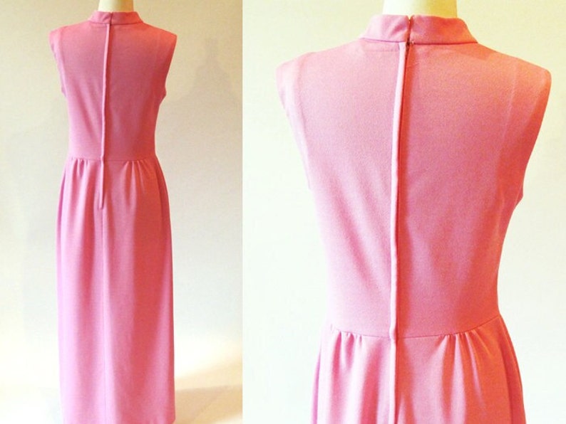 May include: A sleeveless pink maxi dress with a high neckline and a back zipper closure.