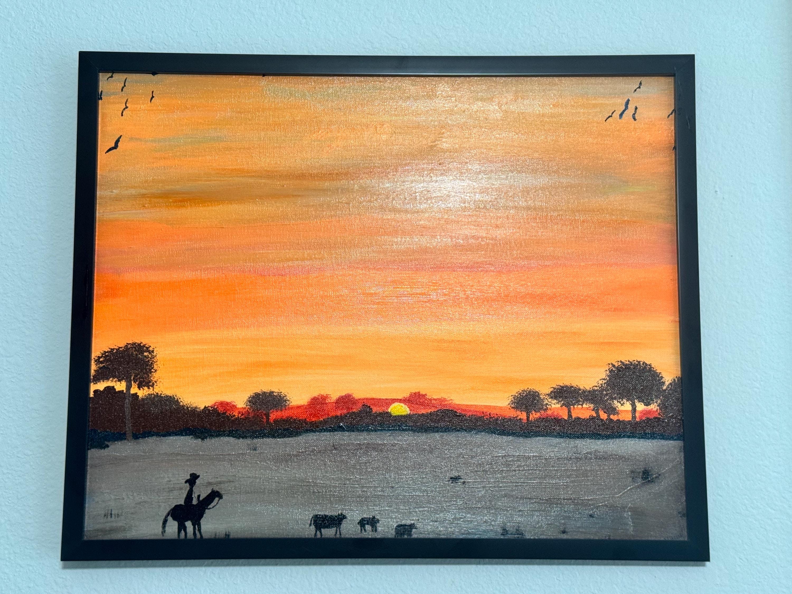 カウボーイの夕焼けの絵画：16x20インチの額入りウエスタンアート