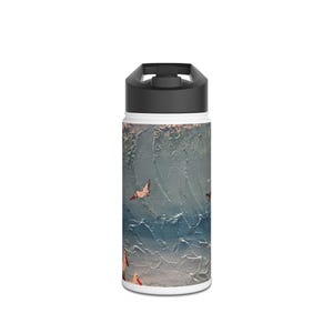 May include: A white and black insulated water bottle with a textured, abstract design. The design features a blue and gray background with red and brown butterfly accents. The bottle has a black flip-top lid.