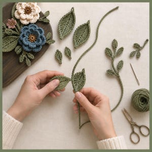 Peut inclure: Fournitures de crochet comprenant une planche en bois fonc&eacute; avec des fleurs bleues et cr&egrave;me, plusieurs feuilles vertes d&eacute;tach&eacute;es, une longue tige verte avec des feuilles, une pelote de laine verte, une aiguille &agrave; coudre et des ciseaux en m&eacute;tal.