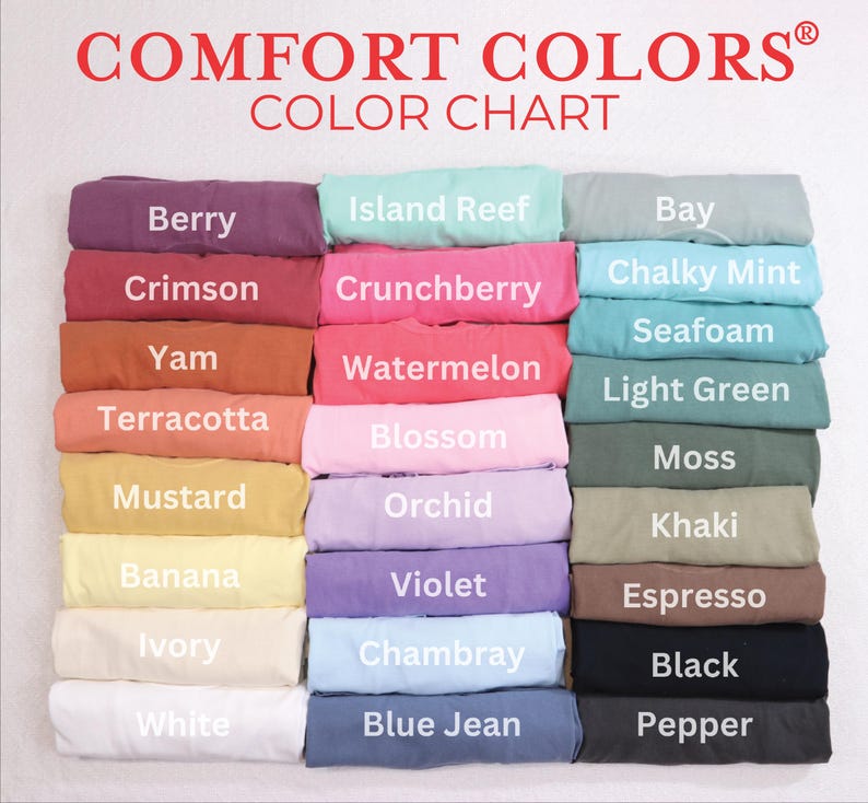May include: A color chart displaying a variety of Comfort Colors t-shirts. The chart features a range of colors, including Berry, Crimson, Yam, Terracotta, Mustard, Banana, Ivory, White, Island Reef, Crunchberry, Watermelon, Blossom, Orchid, Violet, Chambray, and Blue Jean.