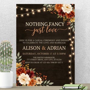 May include: A wedding invitation with a dark wood-grain background. The text "NOTHING FANCY just love" is in a copper-coloured script. Floral arrangements and string lights frame the text. The invitation includes the names Alison & Adrian.
