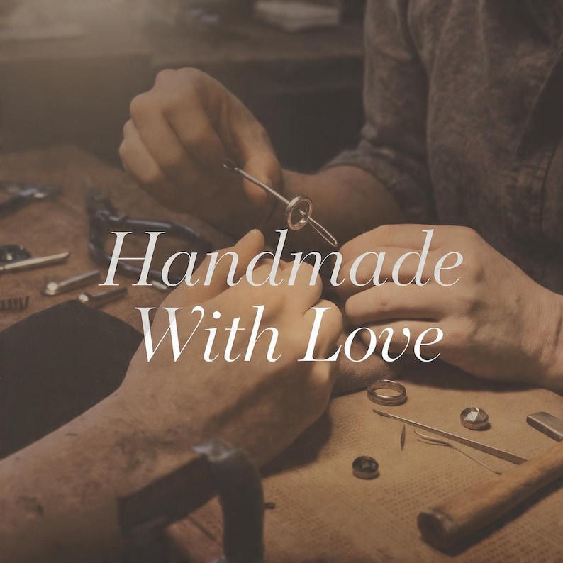 May include: A close-up of hands working on jewelry, with the text "Handmade With Love" in a cursive font. Various tools and partially completed rings are visible on a work surface, suggesting a craft or artisan theme.