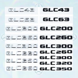 Könnte beinhalten: Eine Sammlung von Autoemblem-Aufklebern mit den Modellbezeichnungen GLC43, GLC63, GLC200, GLC260, GLC300, GLC220, GLC250 und GLC350. Die Aufkleber sind in Silber und Schwarz gehalten und haben eine glänzende Oberfläche.