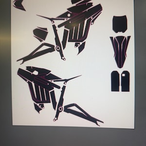 May include: Black and pink graphic design of motorcycle parts, arranged on a white background. The design includes various components, such as the frame, seat, and other mechanical elements. The image is likely a template or guide for customization.