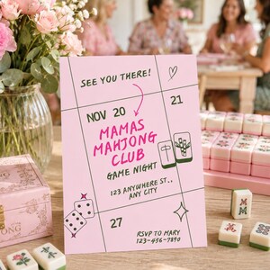 May include: A pink rectangular invitation card with black grid lines and text reading SEE YOU THERE! NOV 20, MAMAS MAHJONG CLUB GAME NIGHT, 123 ANYWHERE ST., ANY CITY, and RSVP TO MARY 123-456-7890. It features illustrations of mahjong tiles, dice, and a heart.