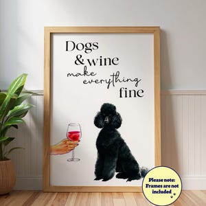 May include: Framed print with the text "Dogs & wine make everything fine." The artwork features a black poodle, a hand holding a glass of red wine, and a note stating that frames are not included.