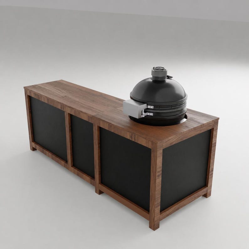 May include: A rectangular wooden kitchen island with a dark brown wood frame and black panels. A black dome-shaped ceramic grill is integrated into the right side of the countertop, featuring a silver metal hinge and a circular top vent.