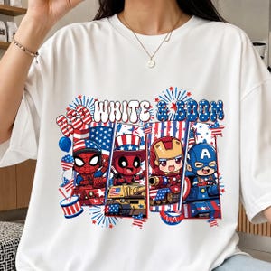 May include: White t-shirt with the text "WHITE & BOOM" and a patriotic design. The graphic features cartoon characters Spider-Man, Deadpool, Iron Man, and Captain America, with American flag imagery.