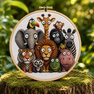 May include: A circular wooden embroidery hoop containing a cross-stitch pattern of a group of cartoon animals including a giraffe, elephant, lion, tiger, zebra, monkey, gorilla, lemur, toucan, frog, crocodile, and hippo on white fabric.