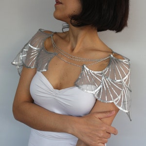 Silver wedding shrug side view with chain drape, Gatsby bridal cape on model in white gown