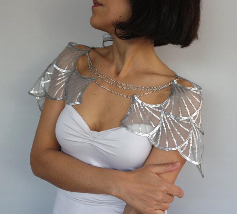Silver wedding shrug side view with chain drape, Gatsby bridal cape on model in white gown