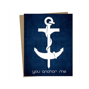 May include: A white anchor with a rope wrapped around it on a blue background. The text "you anchor me" is below the anchor.