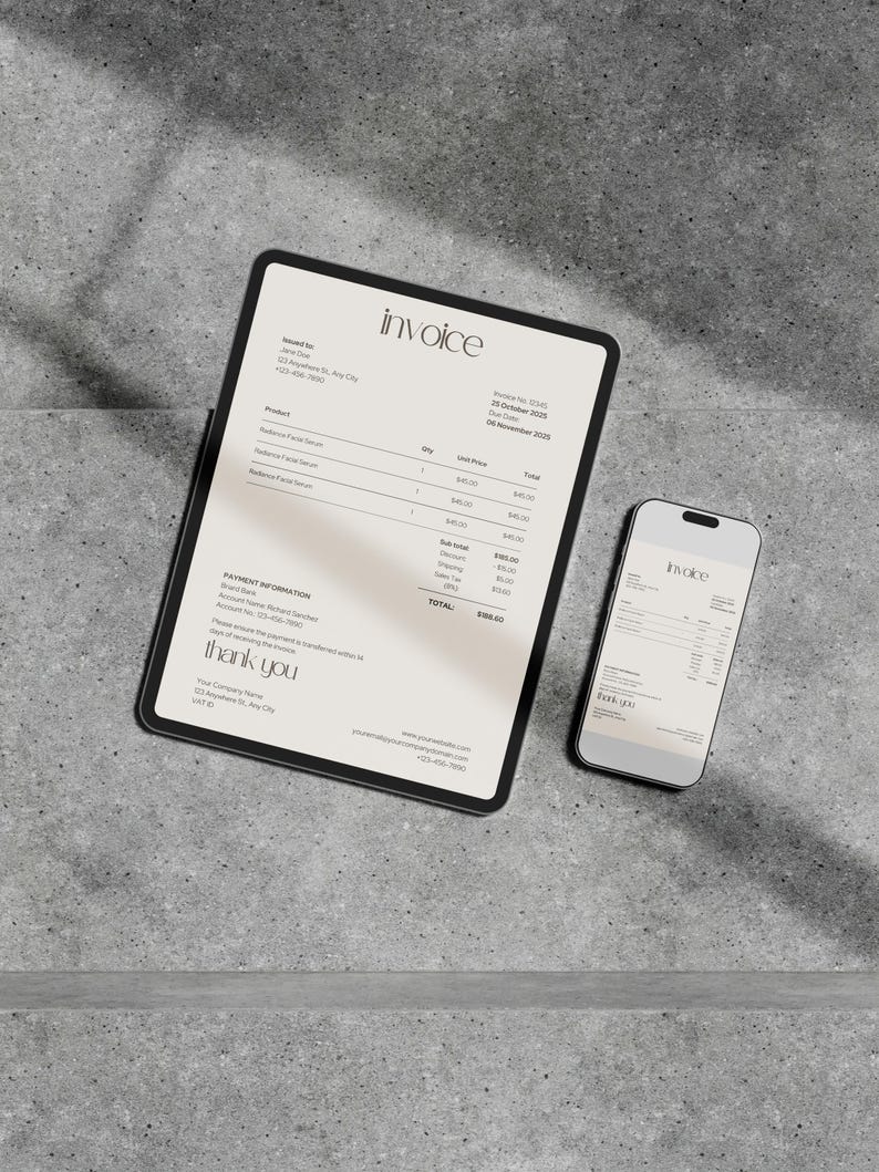 May include: A digital invoice displayed on a tablet and smartphone. The tablet shows the word "invoice" at the top, with product details and a total. The smartphone mirrors the invoice. Both devices are on a gray surface.