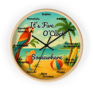 May include: A round wall clock with a light wood frame. The clock face features a beach scene with a parrot, palm tree, and a cocktail. Text reads "It's Five O'Clock Somewhere" with city names around the clock.