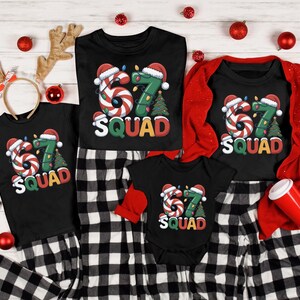May include: A collection of matching black shirts and pajamas with a Christmas theme. Each shirt features a candy cane-style "67" design with a Santa hat and the word "SQUAD". The pajamas are black and white checkered.