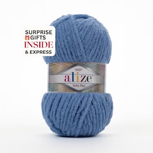May include: A ball of soft, blue Alize Baby Softy Plus yarn. The yarn is wrapped with a label that reads "Baby Alize Softy Plus." A white box with red text reads "SURPRISE GIFTS INSIDE & EXPRESS."