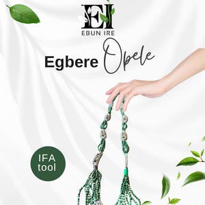 May include: An Egbeere Opele, an IFA tool, is displayed against a white background. The tool is held by a hand and features green beads, silver metal accents, and a green and white cord. The text "Ebun Ire" and "Egbeere Opele" are also visible.