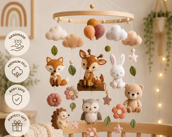May include: A nursery mobile featuring felt figures of a fox, deer, rabbit, owl, and hedgehog suspended from a circular wooden frame. The mobile includes felt clouds, balloons, stars, flowers, and leaves in muted earth tones and soft pastel colors.