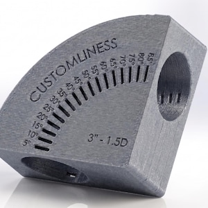 May include: A dark gray, textured, quarter-circle angle measuring tool labeled CUSTOMLINESS. It features a graduated scale from 5 to 85 degrees and is marked with 3" - 1.5D. The object has two circular openings on its flat sides for alignment.