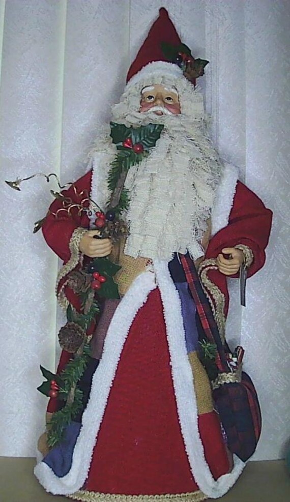 37 Unique Christmas Tree Themes to Inspire Your Holiday Spirit: Deck the Halls Like Never Before! 22 Roman, Inc. 21" Tall Handcrafted Santa Christmas Tree Topper