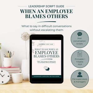 May include: A digital tablet displays a leadership guide titled "When an Employee Blames Others." The guide offers scripts for difficult conversations, with icons indicating real conversation scripts, printable PDF, and content for supervisors and managers. A clock, vases, and books are also visible.