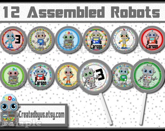 May include: Twelve round cupcake toppers featuring robots with different colored bodies and backgrounds. The robots have large eyes, gears, and some have the name "Carson" printed on them.