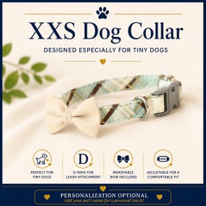 May include: An XXS dog collar featuring a light blue and brown plaid pattern with a solid cream-colored bow. The collar includes a grey plastic buckle, a metal D-ring, and text stating XXS Dog Collar, Designed Especially for Tiny Dogs.
