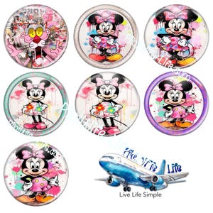May include: A collection of round, colorful buttons featuring cartoon characters. The buttons showcase Minnie Mouse in various poses, dressed in pink and holding flowers. One button features the Pink Panther. A blue and white airplane is also shown.