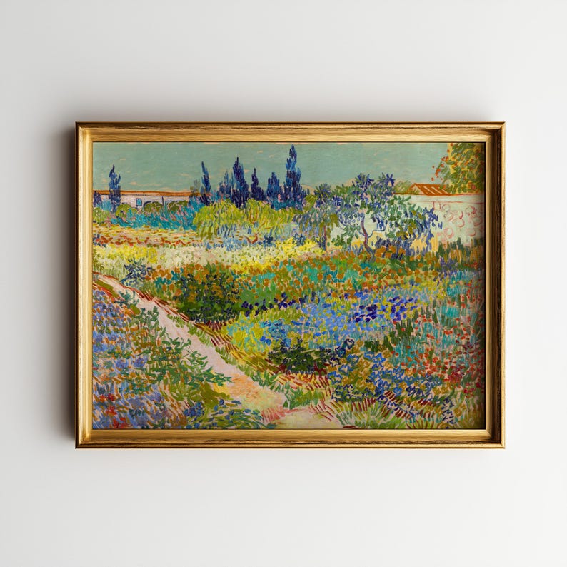 May include: A framed print of a garden scene, featuring a path leading through a vibrant array of flowers and foliage. The artwork, in a gold frame, showcases a palette of blues, greens, yellows, and reds, with a wall and trees in the background.