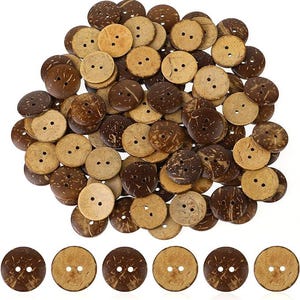 May include: A collection of round coconut shell buttons in various shades of brown, from light tan to dark chocolate. Each button has two holes for sewing. The buttons are scattered, with a few arranged in a row at the bottom.