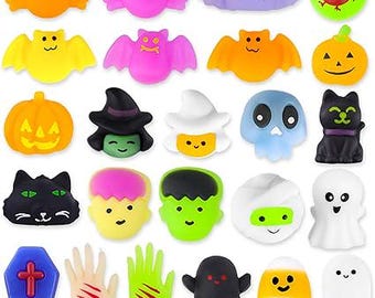 May include: A collection of colorful Halloween-themed toys, including bats, pumpkins, ghosts, and monster faces. The toys are in various colors like orange, purple, yellow, and black. Some have smiling faces and spooky designs.