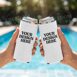 May include: Two white can coolers held up in front of a pool. Each cooler has the text "YOUR DESIGN HERE" in black. The background is a blurred image of a pool and sunlight.